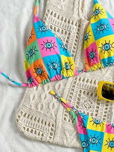 Women's two-piece bikini set with vibrant geometric eye print and colorful grid pattern