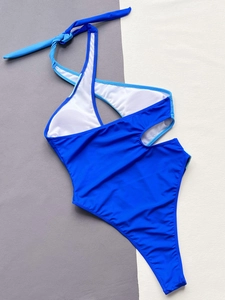 Detail of royal blue one-piece swimsuit with halter neck and side cut-out design