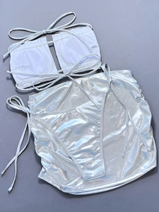 Detailed view of silver metallic 3-piece bikini set with polyester fabric texture labels