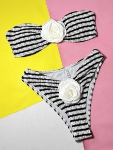 Detail of striped bikini with 3D white rose flower and seersucker textured fabric