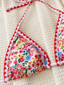 Floral print bikini top with red shell edge trim and halter neck tie for women