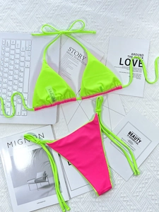 Detail view of neon green and rose pink contrast stitching on tie-side bikini set