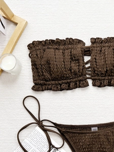 Two-piece chocolate brown smocked bikini set with side-tie bottoms and bandeau top