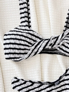 Two-piece black and white striped bikini set with twisted front seersucker fabric