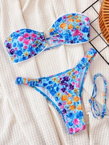 Two-piece floral bikini set with metallic U-ring and high-cut bottoms in colorful print