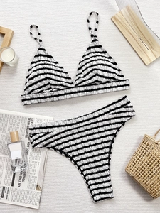 Two-piece black and white striped bikini set with high-waisted bottoms on white background