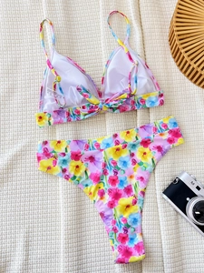 Vibrant floral print two-piece bikini set with triangle top and high cut bottoms for women