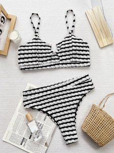 Chic black and white seersucker bikini set with high-waisted bottom and metal ring detail