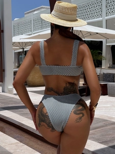 Women's black and white checkered bikini set back view with high waisted bottoms
