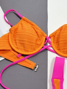 Two-tone bikini set with orange waffle texture fabric and pink straps featuring metal buckle
