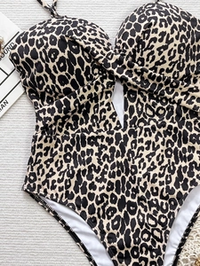 One-piece leopard print swimsuit with cross knot detail and stylish side cut-outs
