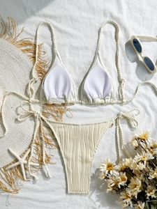 Ivory two-piece halter bikini with textured stripe fabric and shell-style tie details