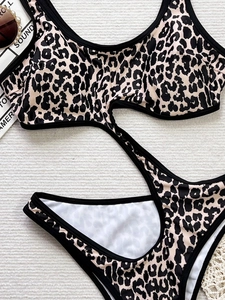 Chic leopard print cutout one-piece swimsuit with black trim for women's beachwear