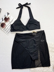 Three-piece black bikini set featuring halter neck top and sheer mesh sarong beach cover-up