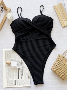 Classic black one-piece swimsuit featuring ribbed fabric and cutout front wrap design