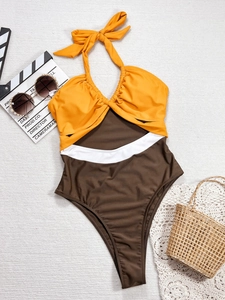 Three-color patchwork halter bikini swimsuit with cutout waist and high-cut leg style
