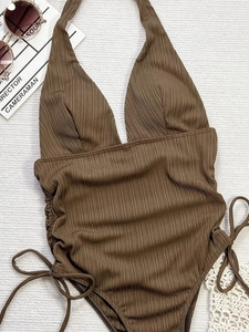 Deep V-neck dark brown ribbed one-piece swimsuit with halter neck and side drawstring detail