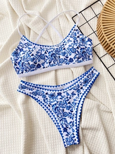 Detail of blue and white floral porcelain print bikini with crossover back straps