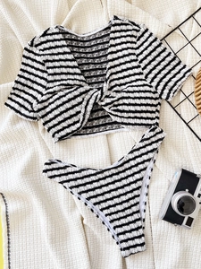 Two-piece black and white striped bikini with short sleeves and high-cut seersucker fabric