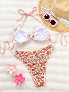 Floral print high-waist bikini set with double straps and colorful summer patterns