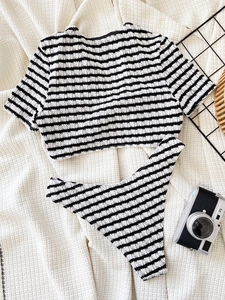 Two-piece black and white striped bikini set with textured fabric and short sleeves