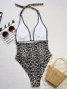 Flat lay of leopard print one-piece swimsuit with plunging V-neck and high cut design
