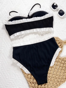 Black ribbed bandeau bikini set with white ruffle trim and high waisted bottom