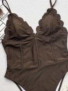 Brown deep V-neck scalloped edge one-piece swimsuit with spaghetti straps on white background