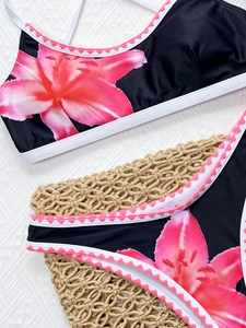 Close-up of pink lily print bikini set with white piping and scalloped trim details