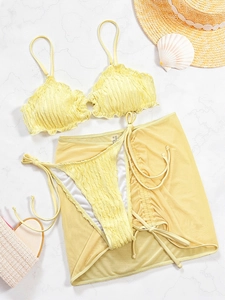 Three-piece light yellow ripple textured bikini set with matching mesh sarong skirt