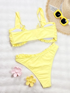 Vibrant yellow ruffle bikini set with high waist bottom and adjustable shoulder straps