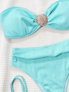 Chic mint green ribbed bikini set featuring a golden shell detail and high waist bottom