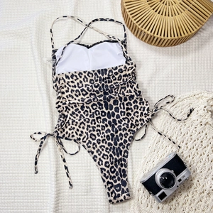 Leopard print one-piece swimsuit with halter neck and side drawstring details