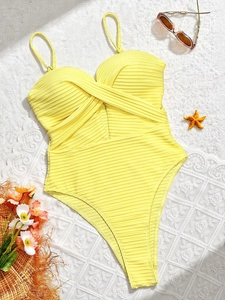 Yellow ribbed one-piece swimsuit with crossover neck and high-cut leg beachwear style