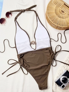 Chic two-tone halter monokini swimsuit with V-neckline and stylish metal ring accent