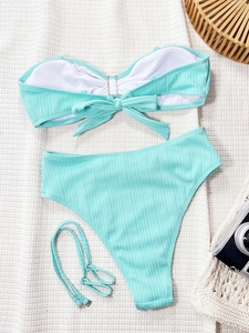 Mint green ribbed high-waisted bikini set with a decorative back bow and straps