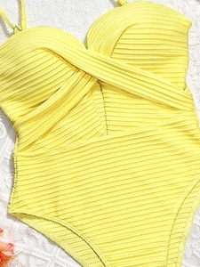 Lemon yellow ribbed one-piece swimsuit with cross-wrap cutout detail and thin straps