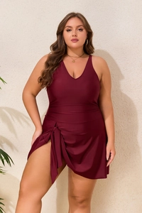 Detail of plus size wine red one-piece swim dress with V-neckline and side tie knot