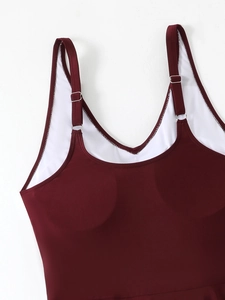 Detail view of wine red plus size swimsuit with adjustable straps and built-in pads