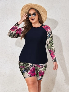 Detail of plus size long sleeve rash guard set with tropical floral print and boyshorts
