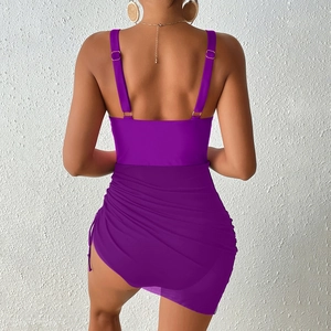 Detail of purple one-piece bikini featuring adjustable back straps and side drawstring