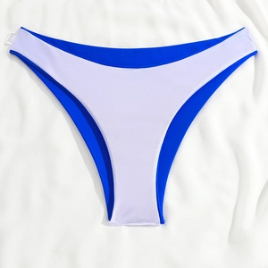 Detail of high-cut bikini bottom with white grid texture and blue lining accents
