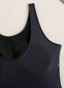 Detail of wide shoulder straps and U-neckline with built-in round pads on swimwear