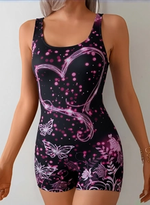 Detail of slim fit one-piece swimsuit featuring pink butterfly and heart floral prints