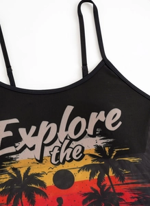 Close-up of black mesh bikini top featuring Explore the tropical sunset graphic print