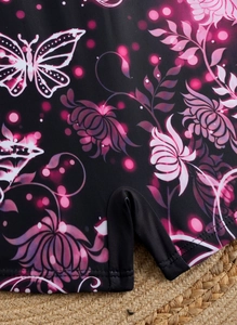 Close-up of floral butterfly print on high-stretch swim fabric with reinforced seams