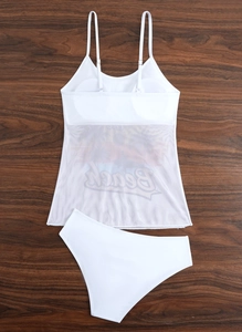 Flat lay of white two-piece bikini featuring sheer mesh top with Beach text and high waist bottoms