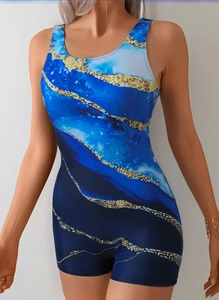 Close-up of women's one-piece swimwear with blue and gold marble print and boyleg cut