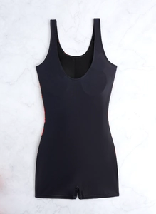 Detail of black boyleg swimsuit featuring sporty U-neckline and colorful floral side panels