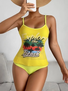 Detail of yellow bikini top featuring Explore the Beach graphic print and palm tree design